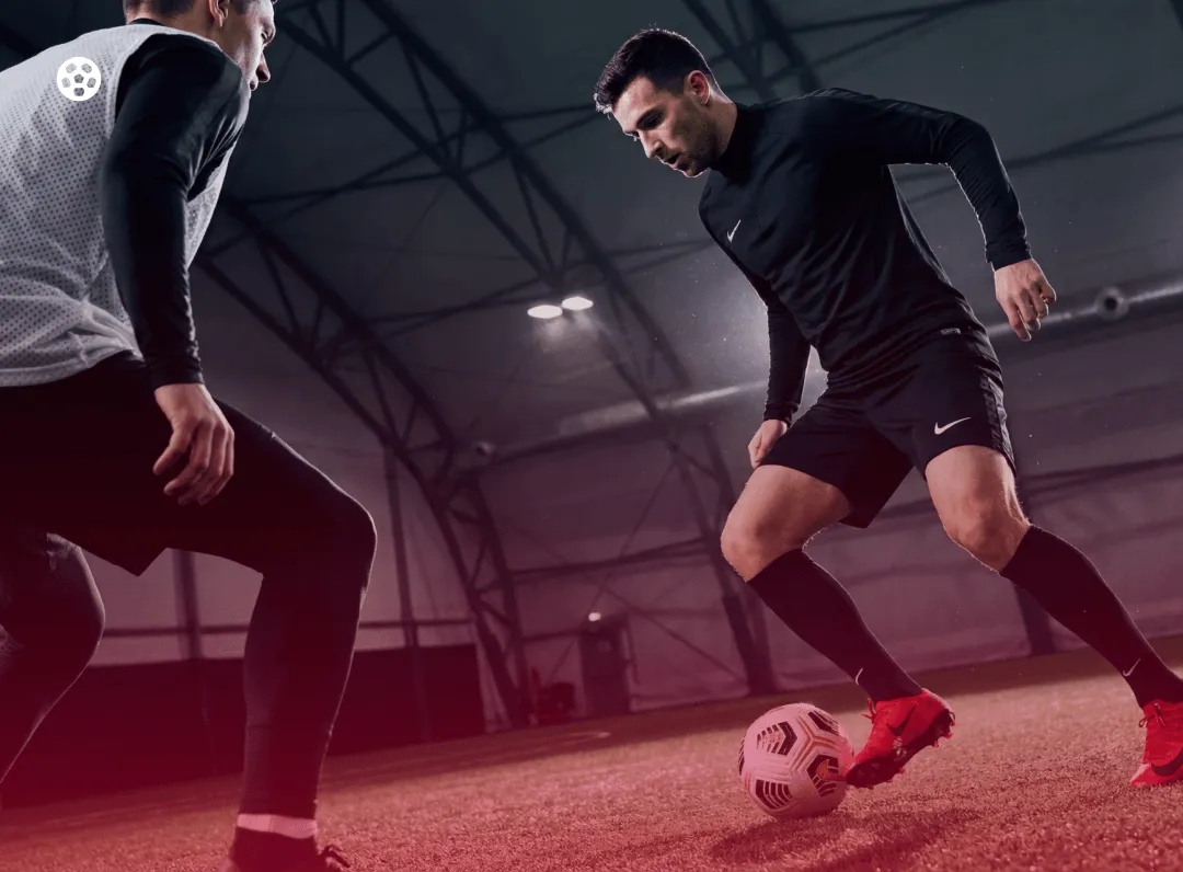 Adult players competing in an indoor soccer game in Mississauga